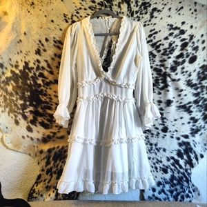 Darling white dress size medium with see-through long sleeve arms